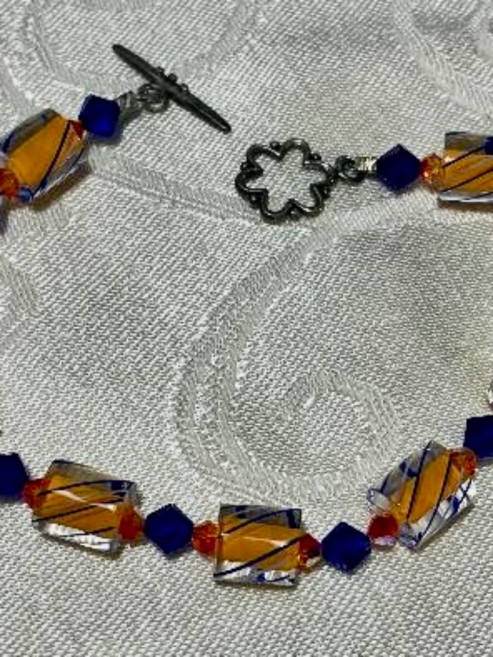 Bracelet, art glass beads & crystals, sterling silver toggle clasp